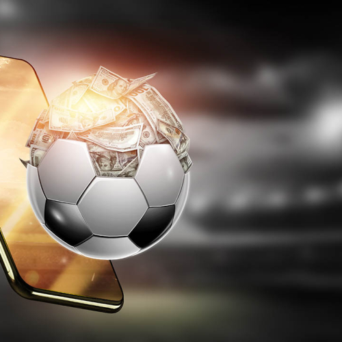 Dollars are inside the soccer ball, the ball is full of money. Sports betting, soccer betting, gambling, bookmaker, big win